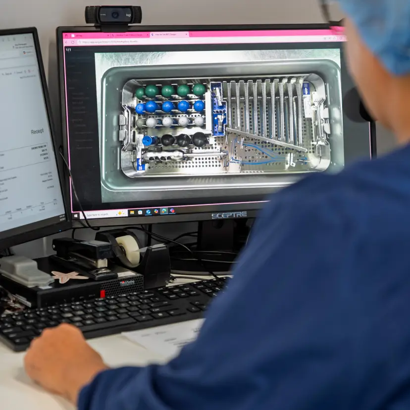 Instrument tray being inspected under magnification